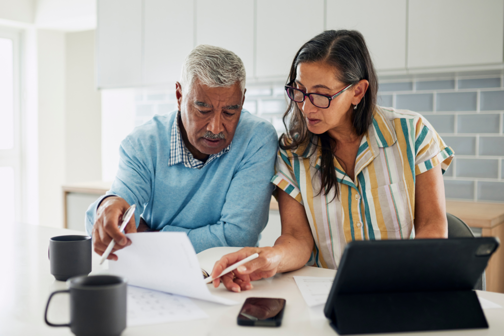 Couple reviewing documents at home